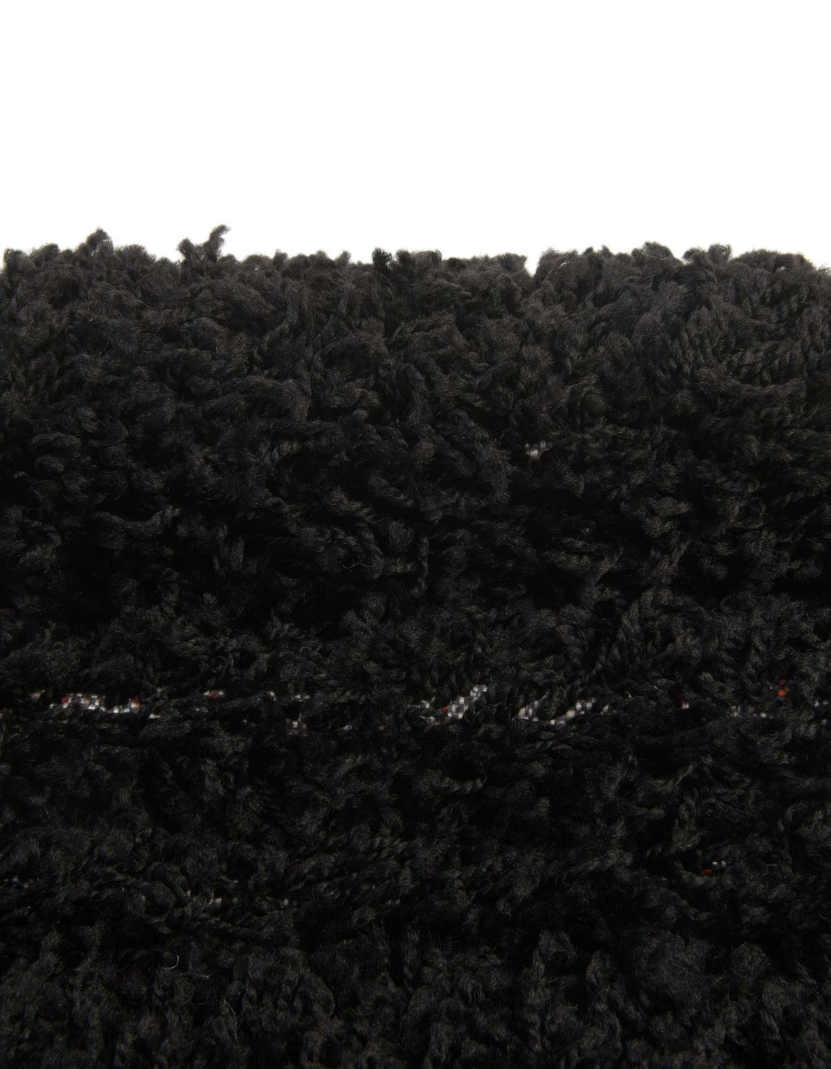 Oval Hochflorteppich Solid Shag in Schwarz von Hadorn™ - Lifestyle Image