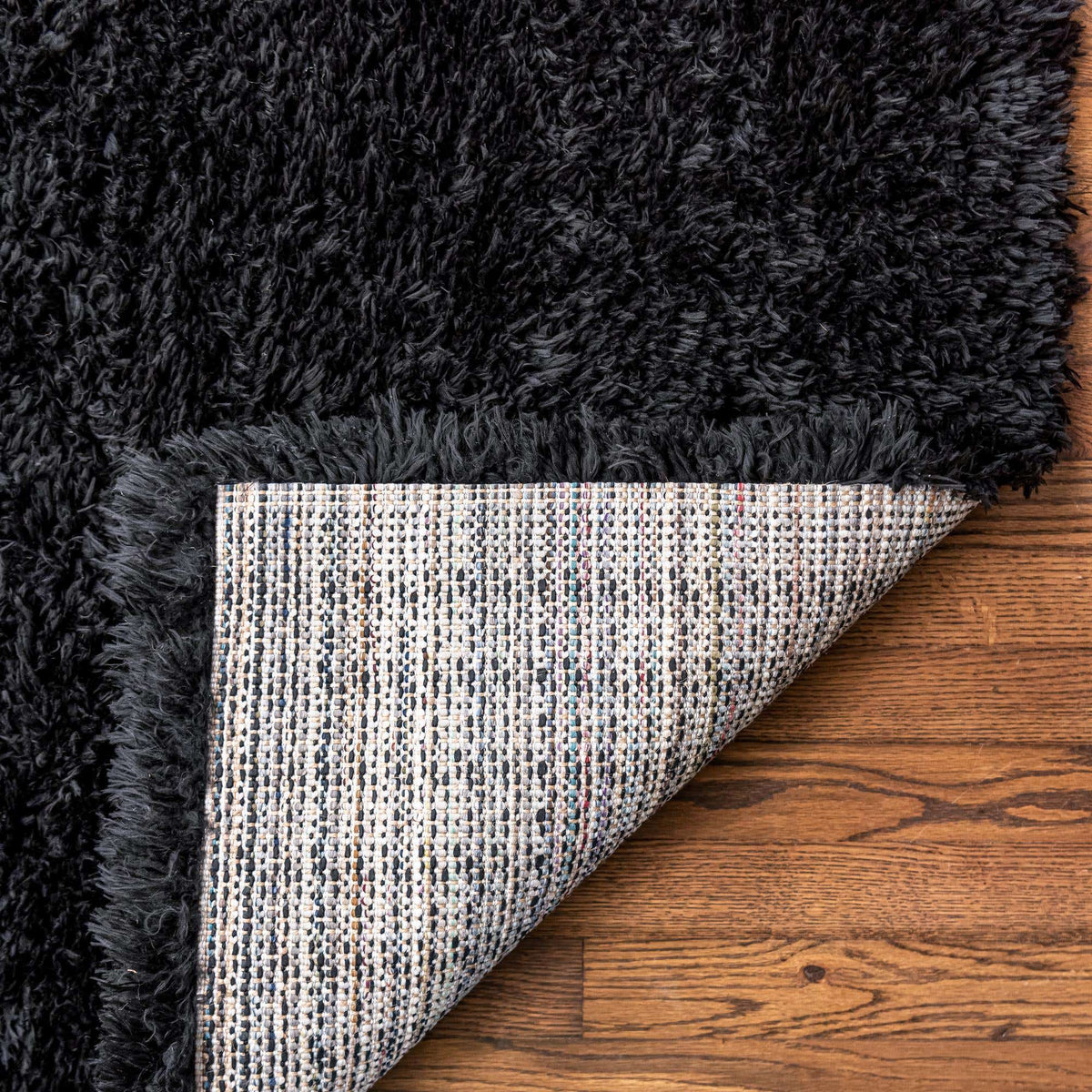Rechteck Hochflorteppich Infinity Shag in Schwarz von Hadorn™ - Lifestyle Image